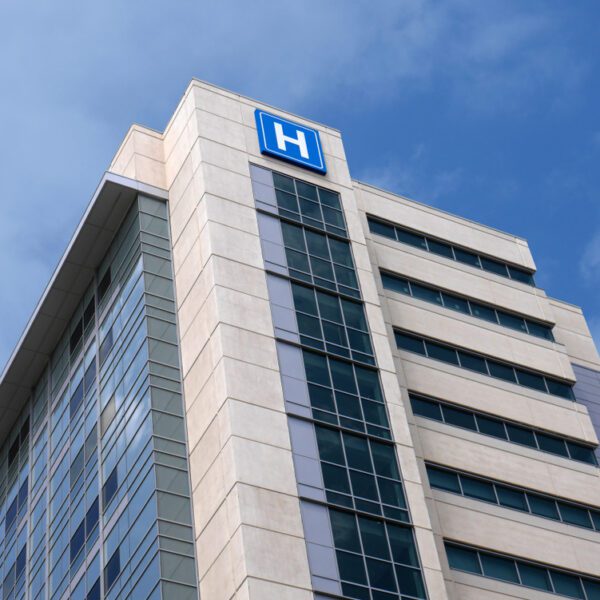 Building,With,Large,H,Sign,For,Hospital