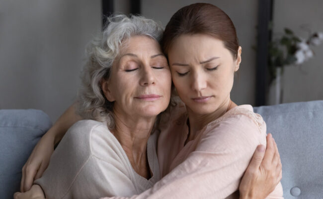 Tender moment with aging mother